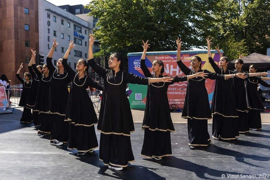 Image at Bell square for the anhad event and group performing dance.