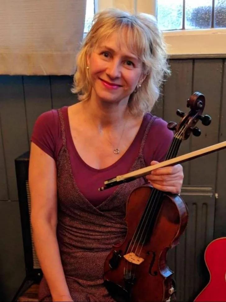Image of Cathy Lemmon holding a violin